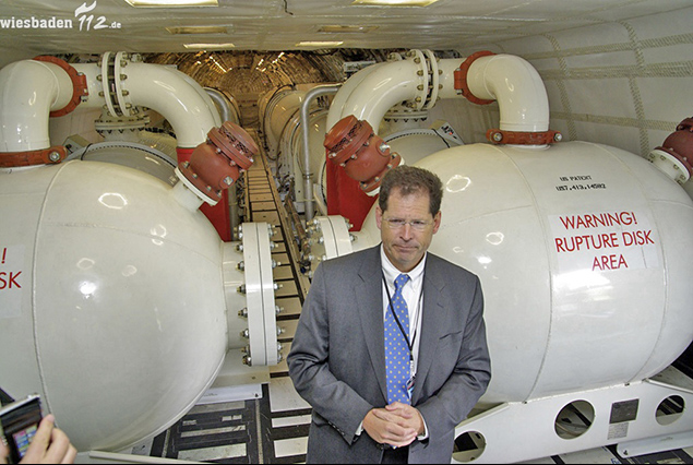 Water ballast tanks with transfer piping inside a flight test airliner cabin