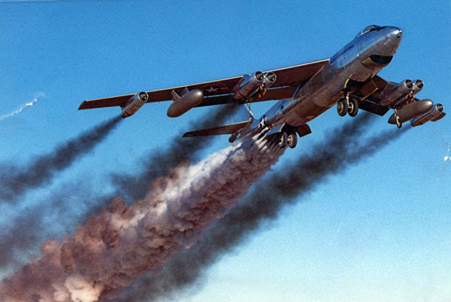 Boeing B-47 Stratojet climbing on rocket-assisted takeoff trailing dense black smoke