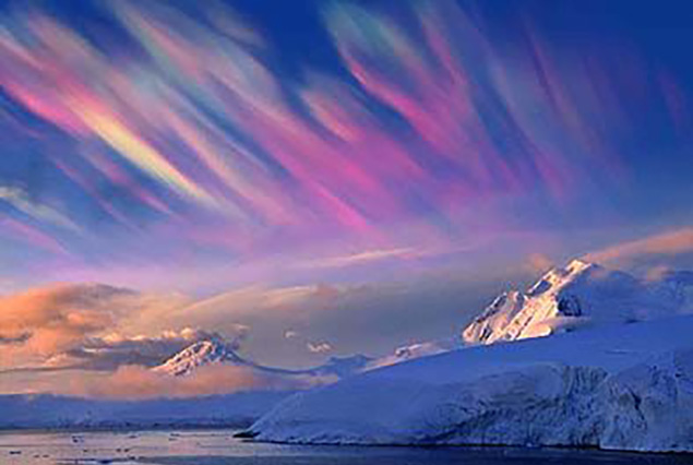 Vivid polar stratospheric clouds over snowy mountains